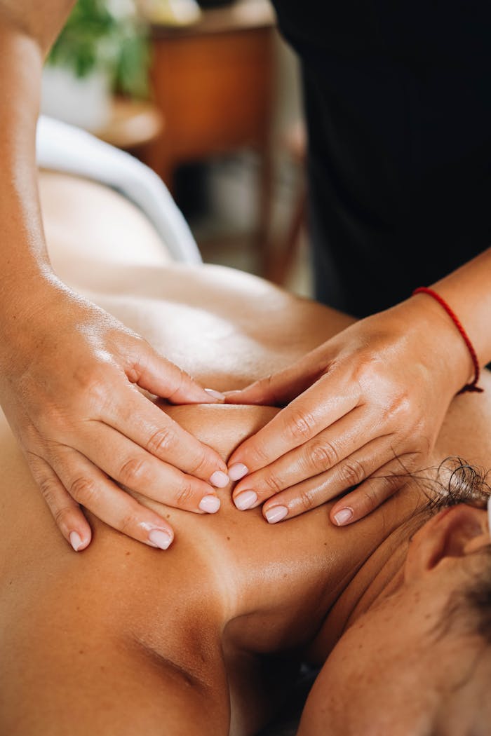 Close-up of a relaxing massage focusing on well-being and wellness in a tranquil spa setting.